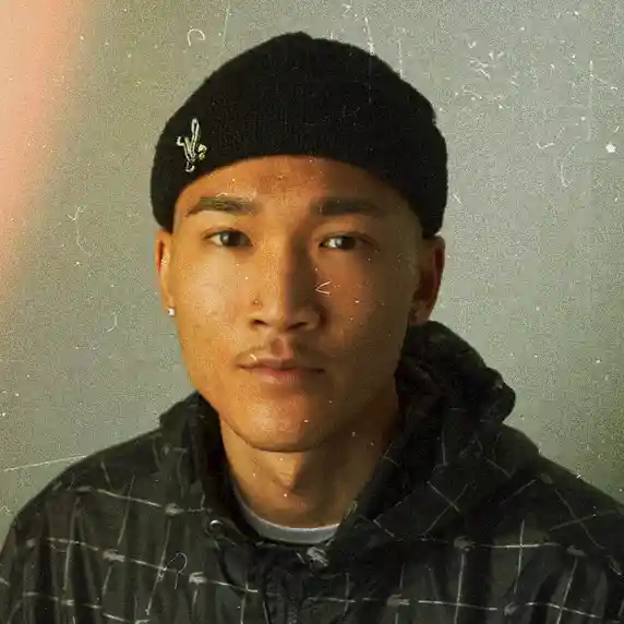 Izzy headshot wearing a black beanie and black hoodie