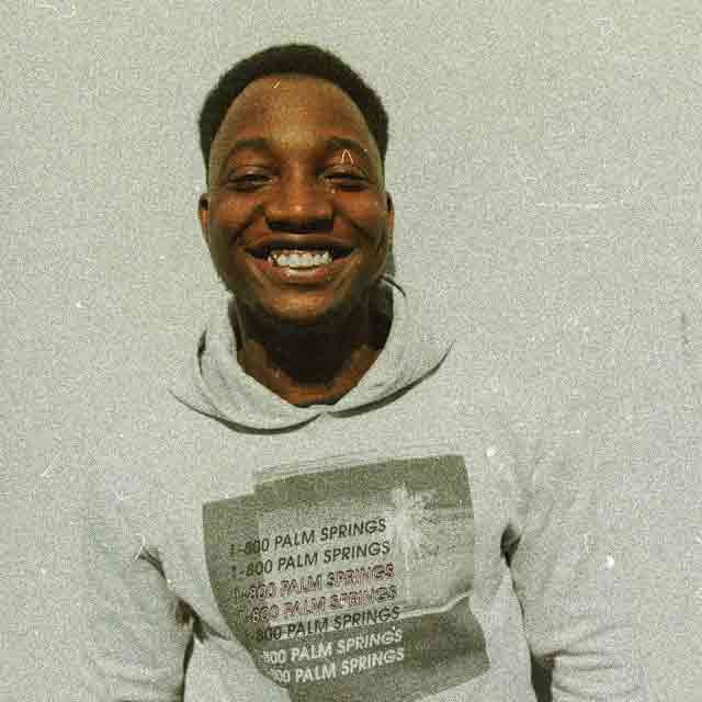 Rico, the co‐founder of Recursive Records smiling at the camera