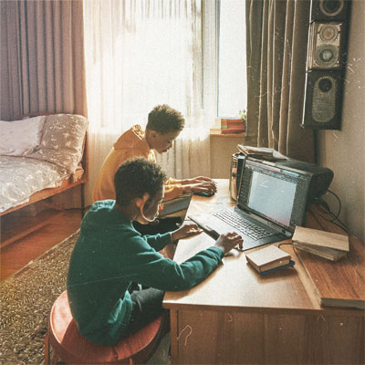 Rico & Dan, in Dan's childhood bedroom on a PC burning music on CD's